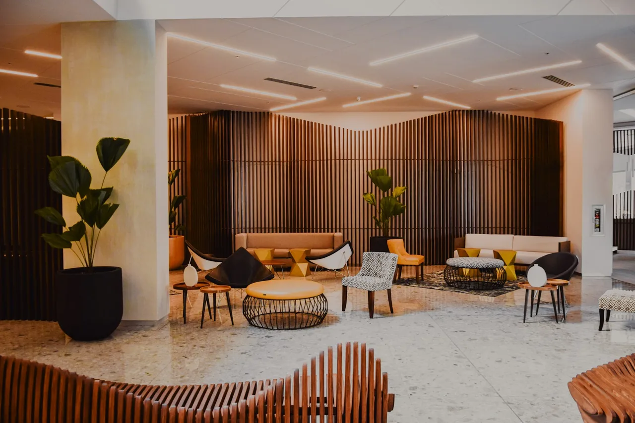 Hotel lobby with wood furnishings and armchairs
